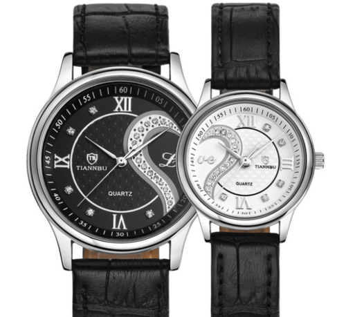 Two black leather watches with silver and black faces on a white background

