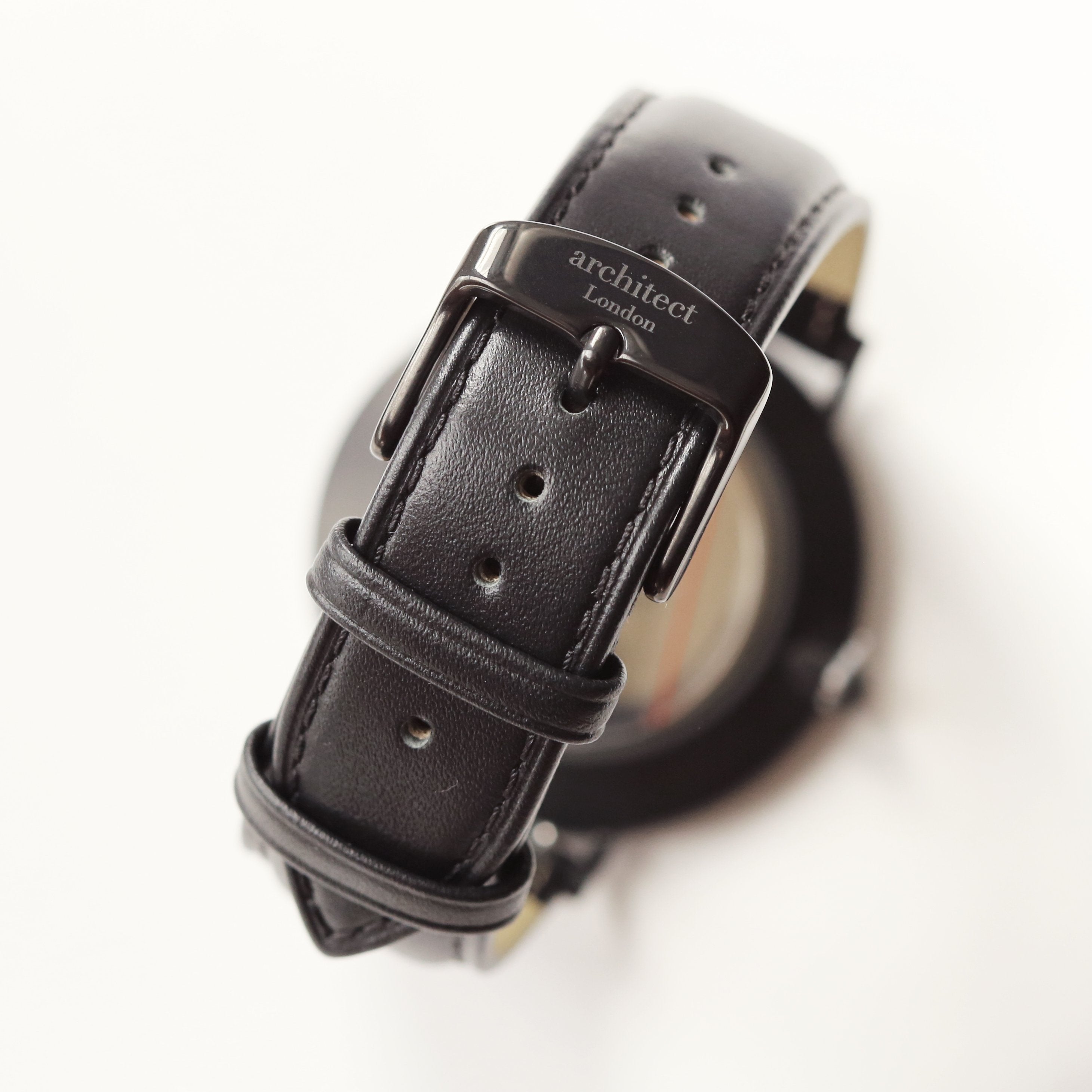 Black leather watch strap with 'architect London' branding on a white background

