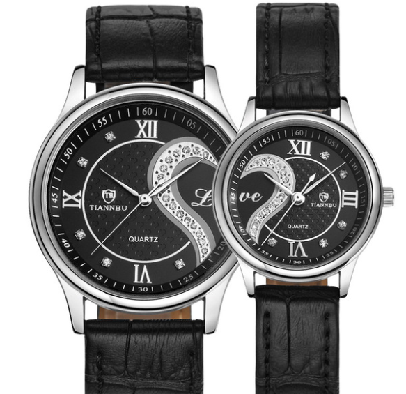 Two black wristwatches with decorative faces on a white background