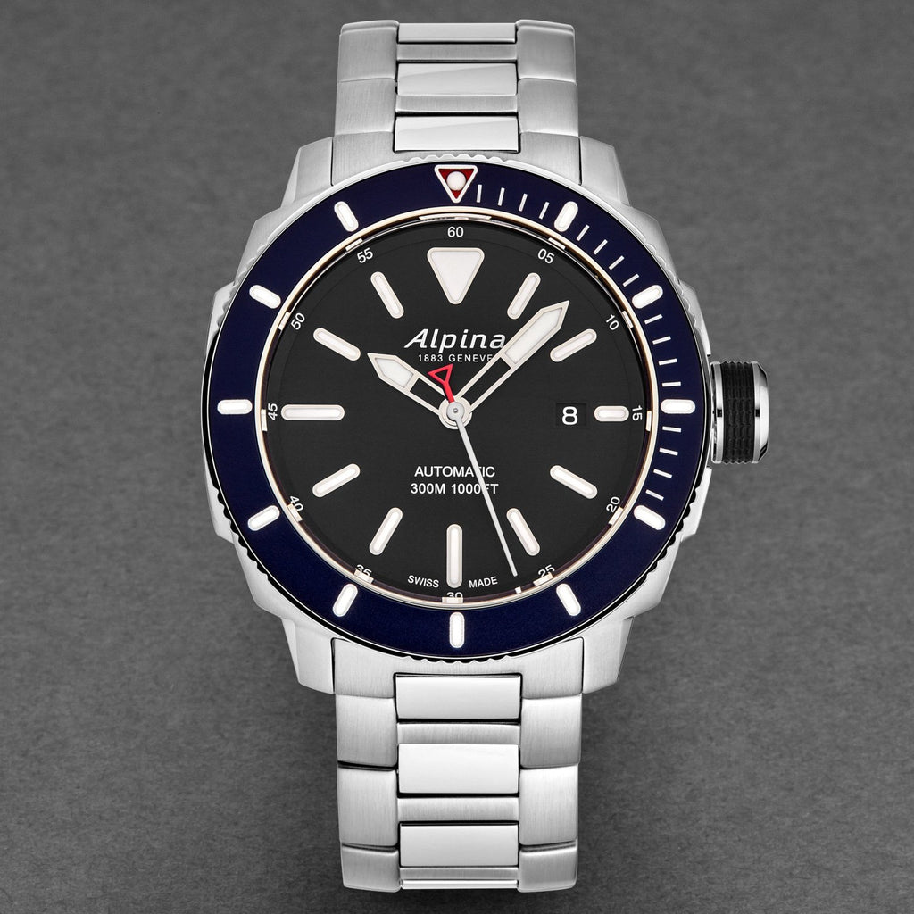 Alpina watch with silver bracelet and black dial on a gray background