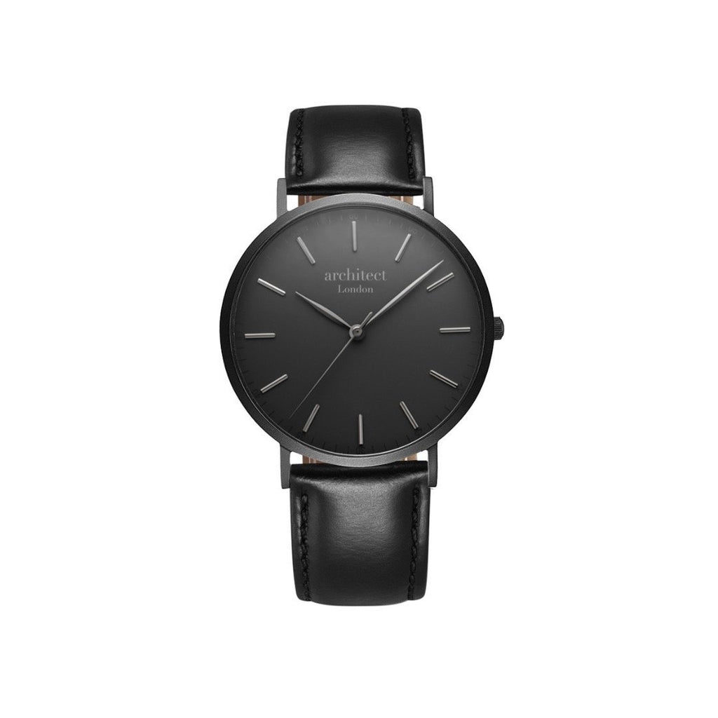 Black watch with leather strap on a white background