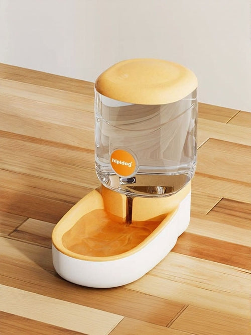 Clear glass container with wooden top and base on a wooden surface