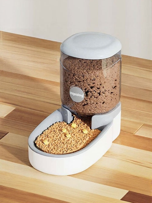 Pet food dispenser with food on a wooden surface