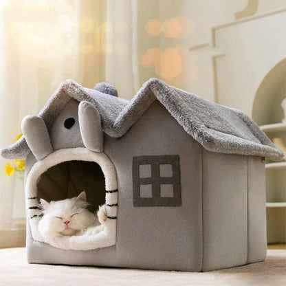 Cat sleeping in a cozy gray pet house with a small window and rounded entrance.

Details