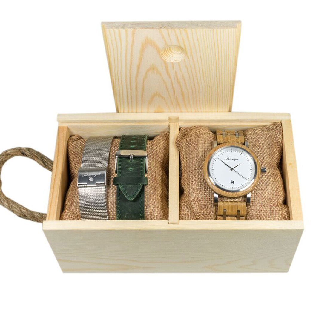 Wooden gift box with a watch and two straps on a white background