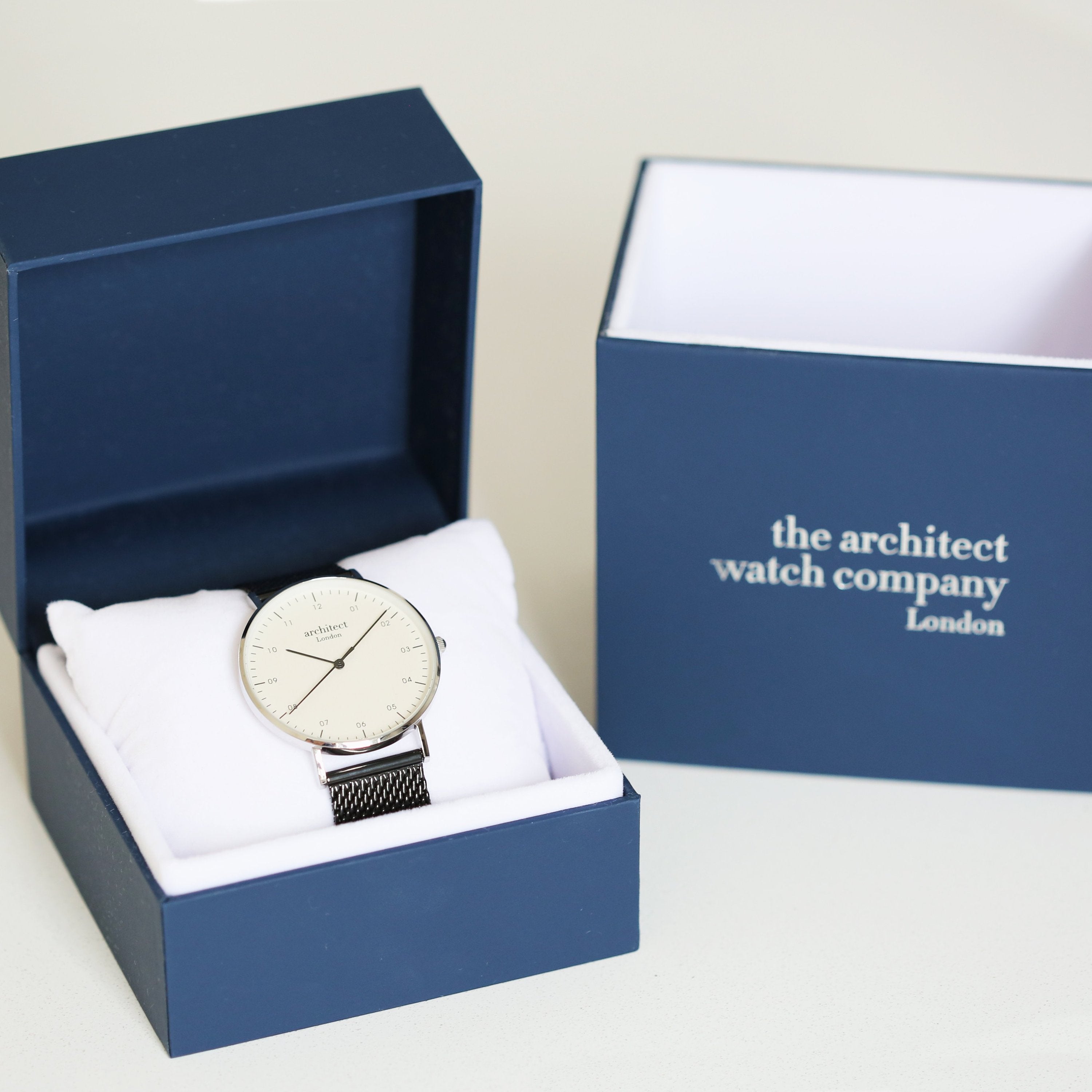 Watch in a blue box with 'the architect watch company London' branding.