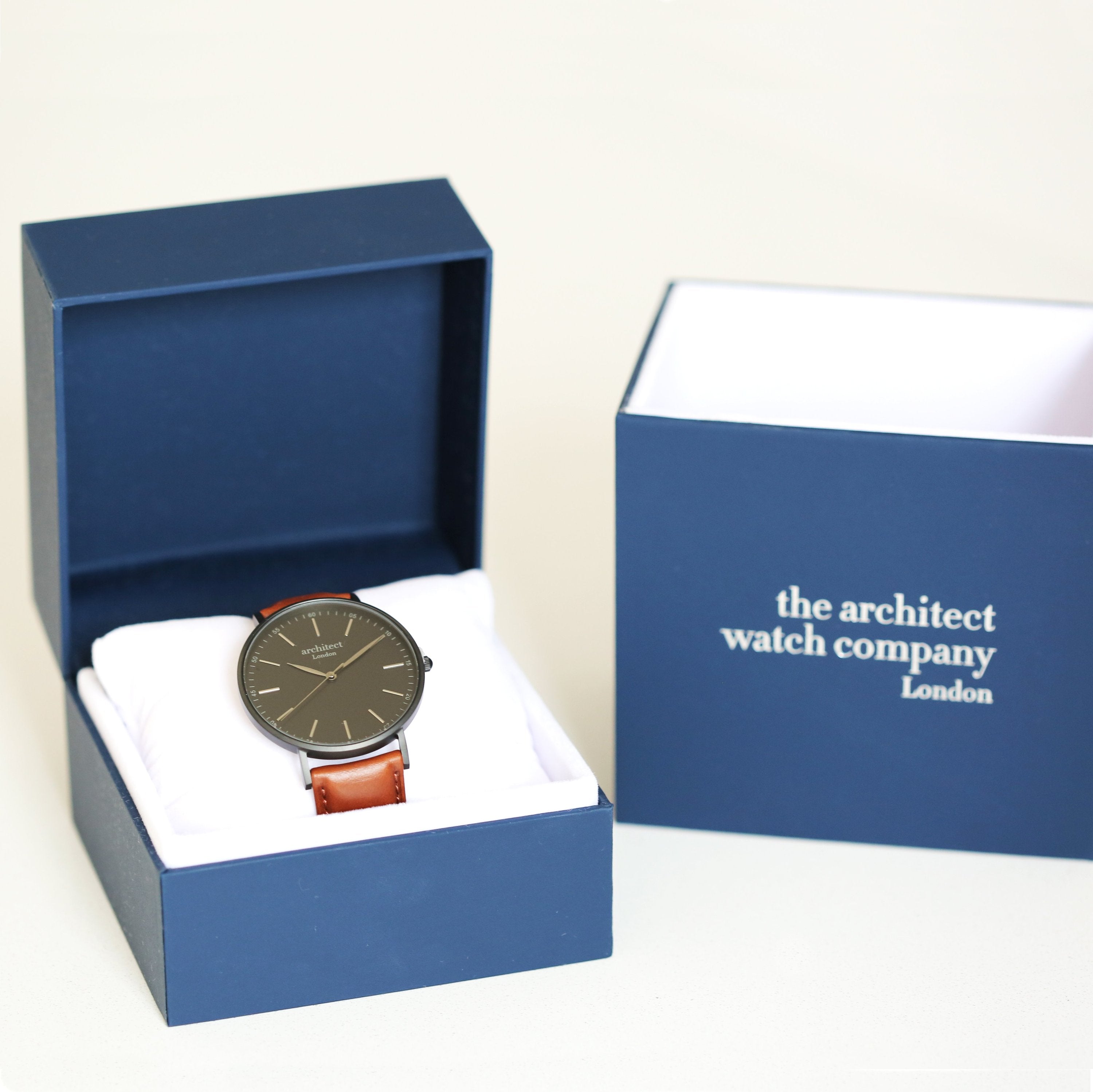 Watch in a blue box with 'the architect watch company' branding.