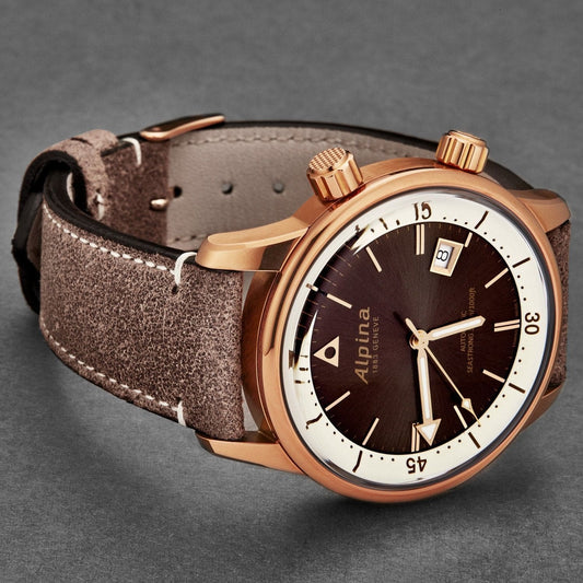 Watch with brown leather strap and rose gold case on a gray background