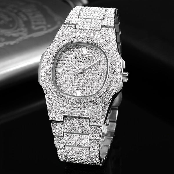 Silver diamond-encrusted watch on a dark background