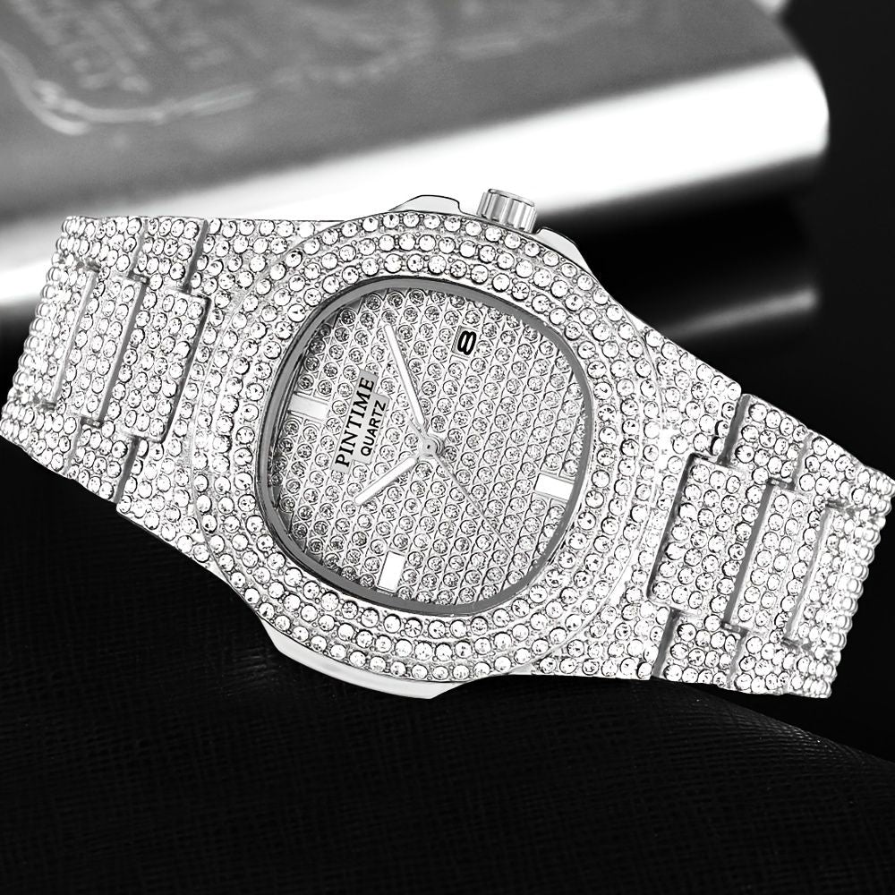 Luxury watch with a diamond-studded band on a dark background