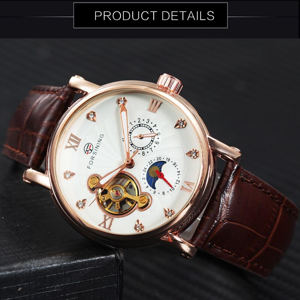 Luxury watch with brown leather strap and white face on a dark background