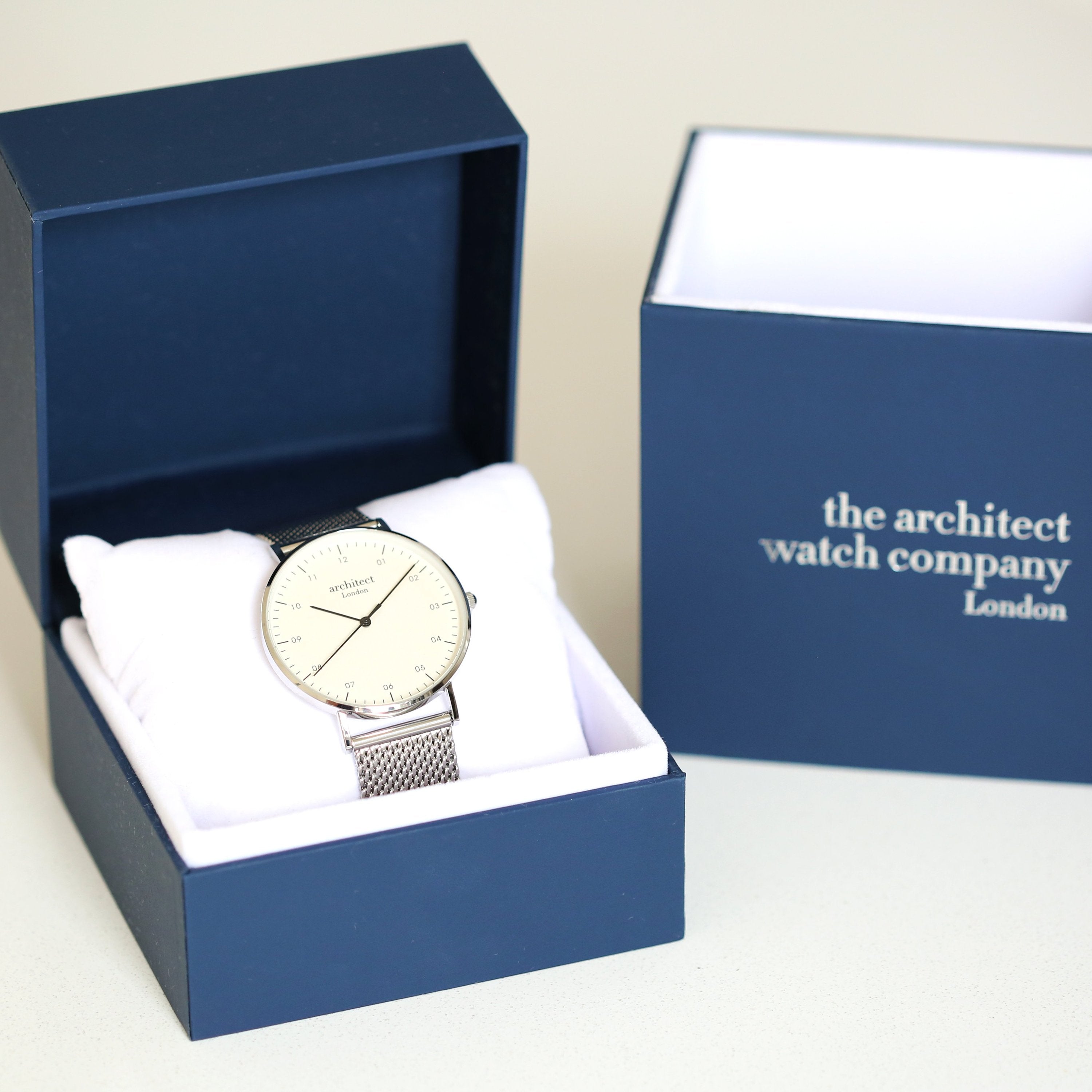 Watch in a blue box with 'the architect watch company London' branding.