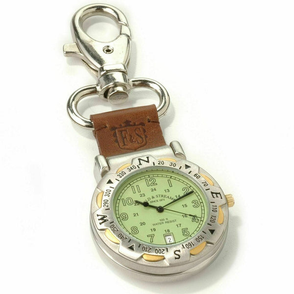Keychain with compass and watch face on a white background